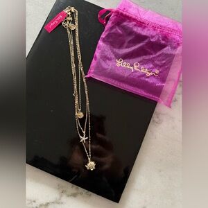 NWT Lilly Pulitzer Gold layered charm necklace featuring starfish,fish